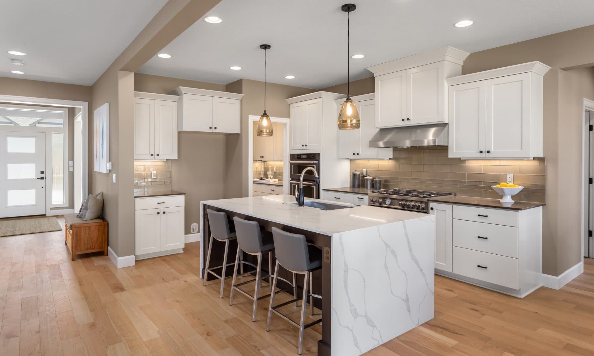 Custom white shaker kitchen remodel with quartz waterfall island, Orlando FL